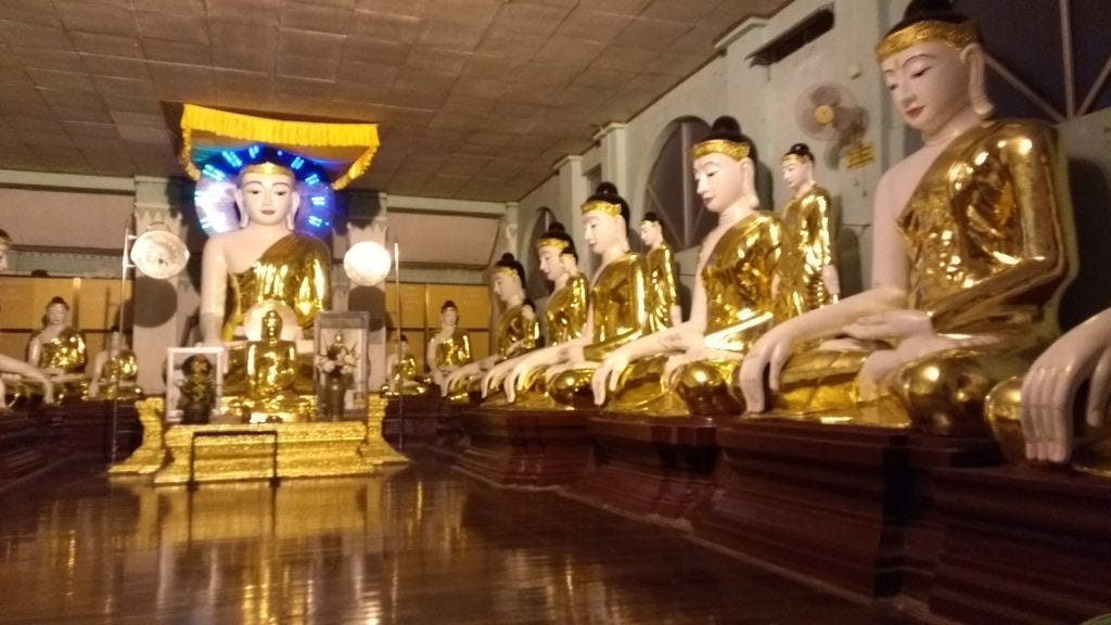 Gold Buddhas in a row