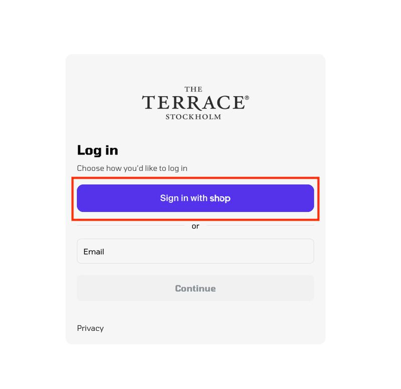 Screenshot of a Shopify login page with the "Sign in with Shop" button highlighted with a red rectangle.