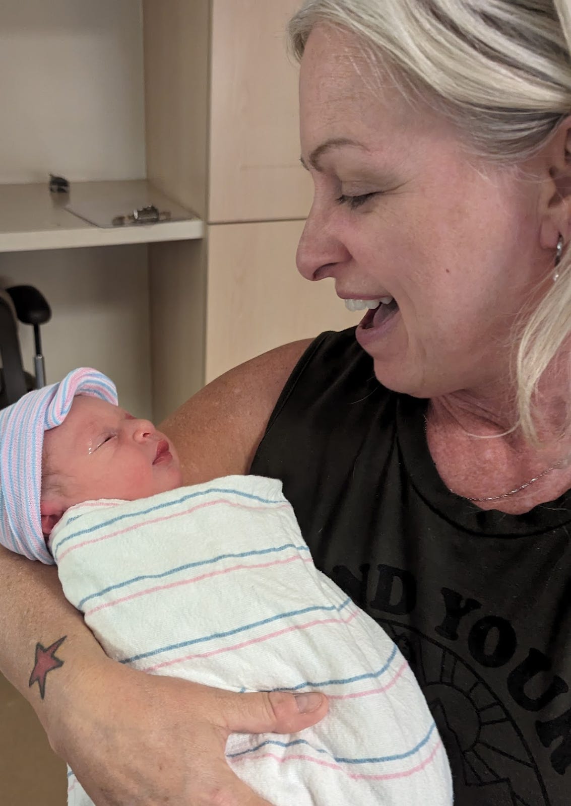 Jeanne holding her new grandson