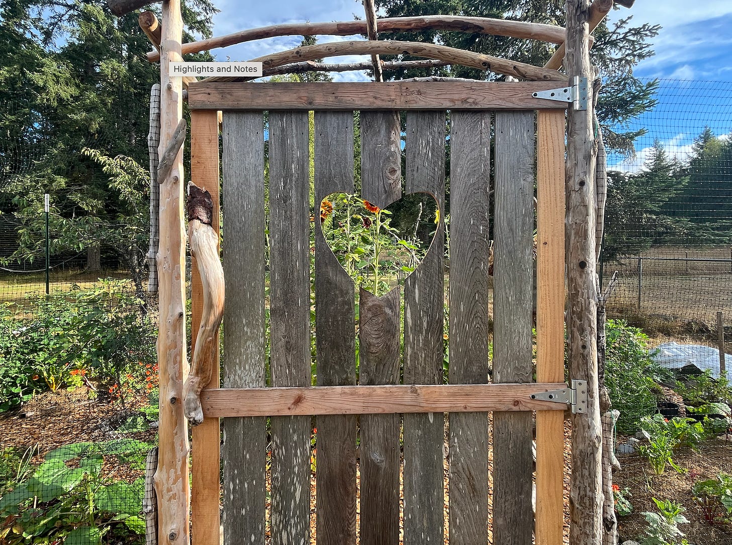 wooden garden gate with heart carved out