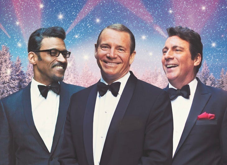 Christmas Music Shows In London 2024: A Rat Pack tribute act with festive scenery behind them