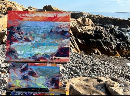 A painting on a rocky beach

Description automatically generated