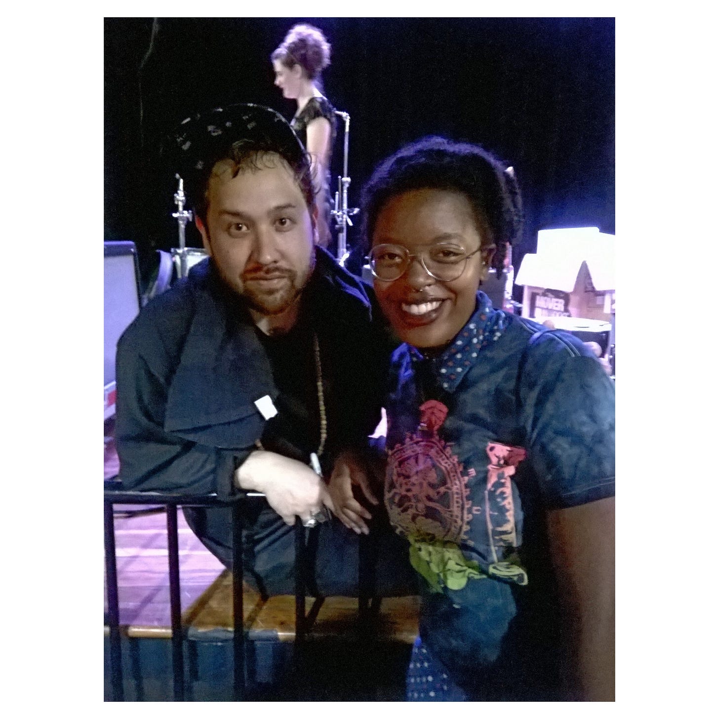 a photo of singer Ruban Nielson in a black printed baseball cap and yours truly in a pair of aviator glasses and a tie-dye t-shirt. i met the singer after the 2015 show ended.