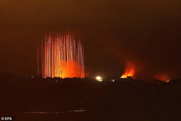 Israeli artillery shells hit areas near villages in southern Lebanon along the border with Israel, as seen from the Upper Galilee, northern Israel