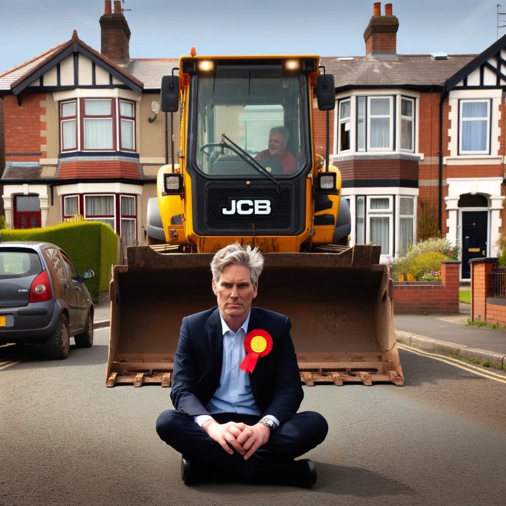 Keir Starmer sitting down in front of a JCB digger on a residential street in Britain, blocking its path. He has grey hair and is wearing a red rosette. He is dressed in a smart suit, with a determined expression. The residential street features typical British houses, with brick facades, front gardens, and parked cars along the road. The JCB digger is stopped directly in front of him, with the operator looking surprised. The scene is set during daylight, with clear skies overhead.