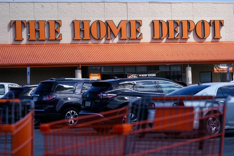 FILE - Shopping carts are parked outside a Home Depot in Philadelphia, Sept. 21, 2022. Alexandre Henrique Costa-Mota was given nearly $300,000 in fraudulent Home Depot credit by walking into stores in several states, taking expensive doors and then returning them without a receipt, federal prosecutors allege. Costa-Mota, of Connecticut, was detained without bail after a judge entered not-guilty pleas on his behalf this week in federal court in Rhode Island to wire fraud and conspiracy to commit wire fraud, the U.S. attorney’s office in Providence said in a statement Wednesday, Aug. 2, 2023. (AP Photo/Matt Rourke, File)