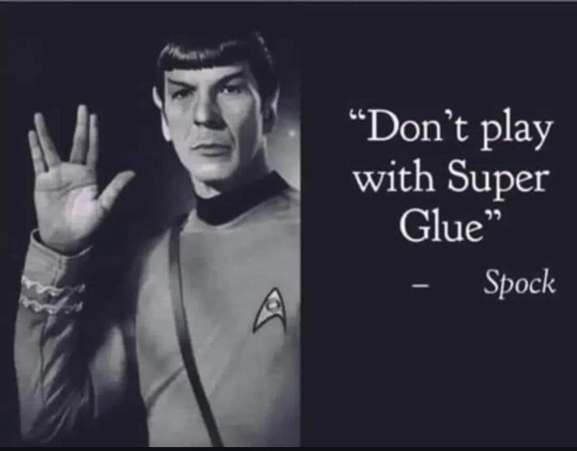 A black and white picture of Spock holding up the infamous Vulcan hand gesture (parted in the middle, two fingers on each side). There’s a quotation from him that says, “Don’t play with Super Glue”