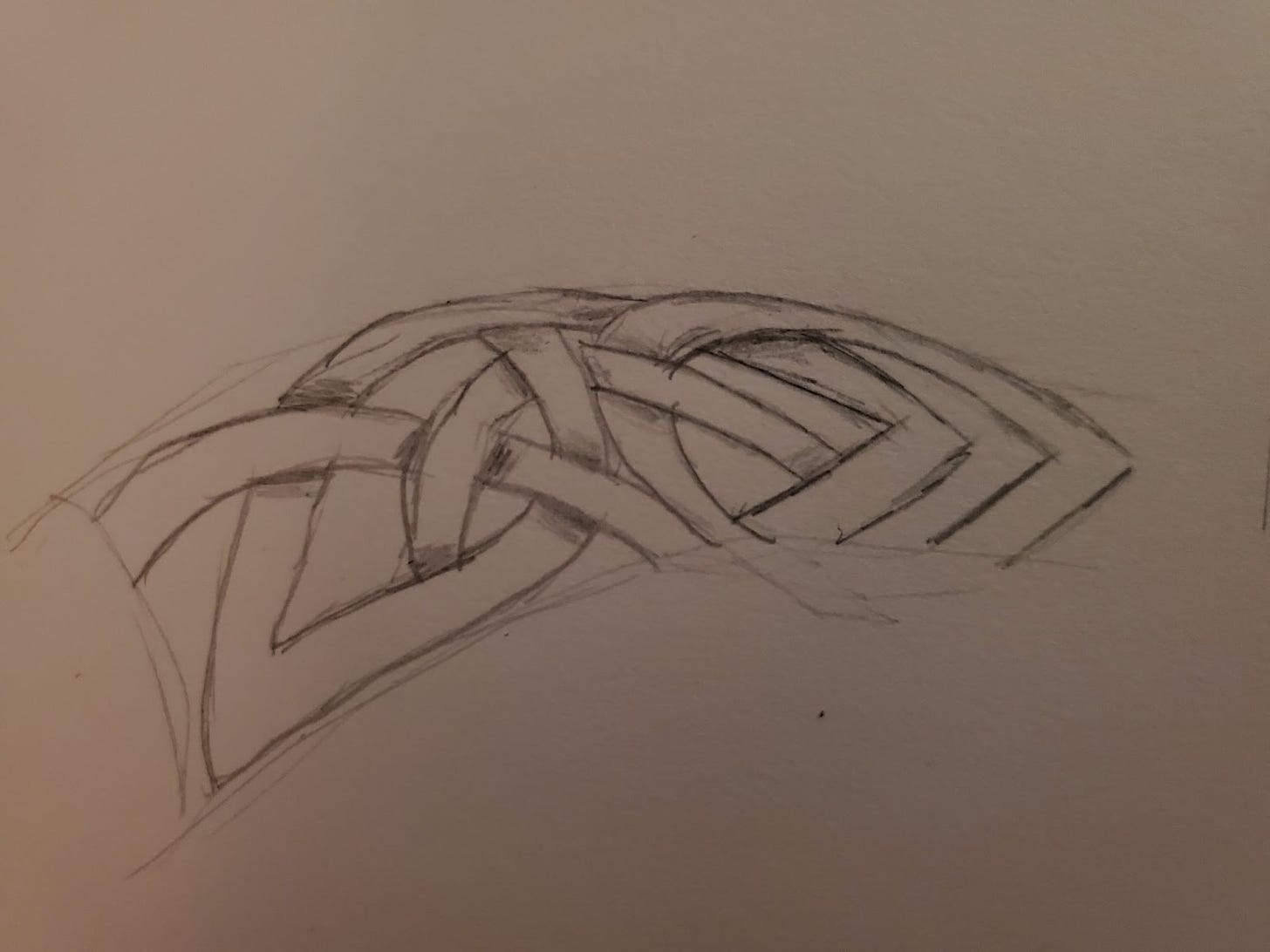 pencil sketch on paper of a celtic knot-style design