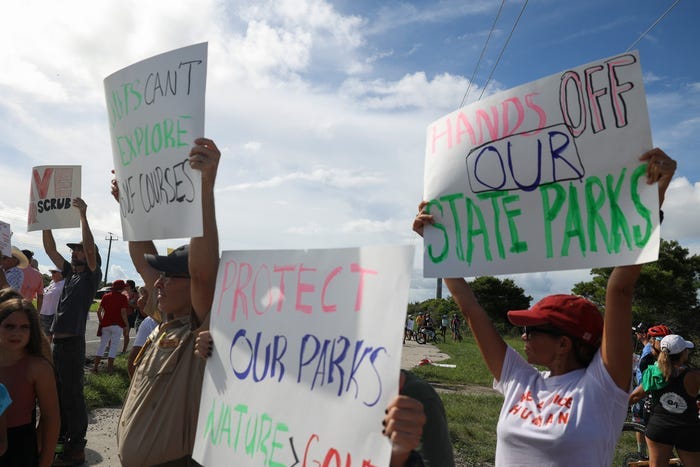 Hundreds protest proposed golf courses at Jonathan Dickinson State Park