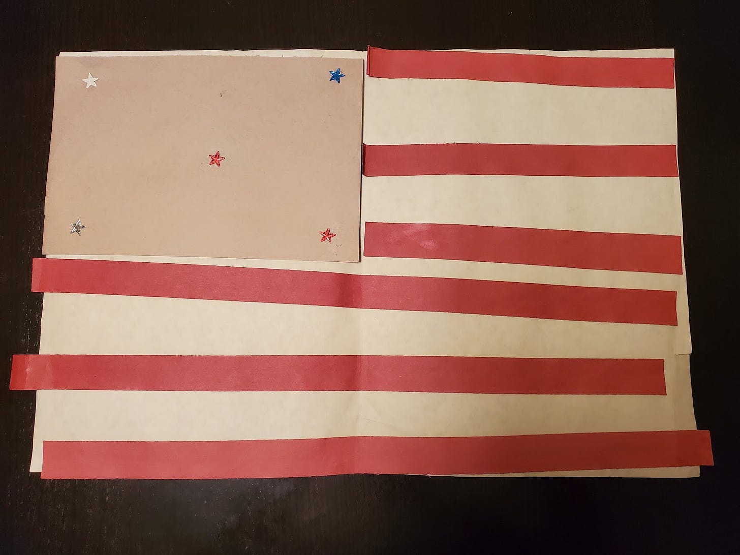 The blue field has faded, but this construction-paper flag meant and still means the world to me. Artist: Ali Pellecchia, 4 years old.