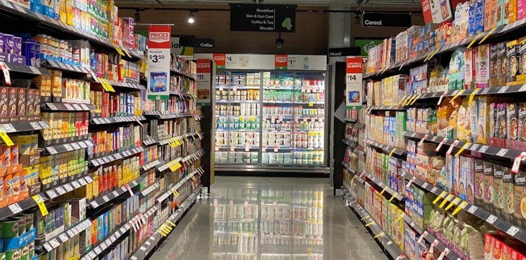 white and red labeled pack on white shelf