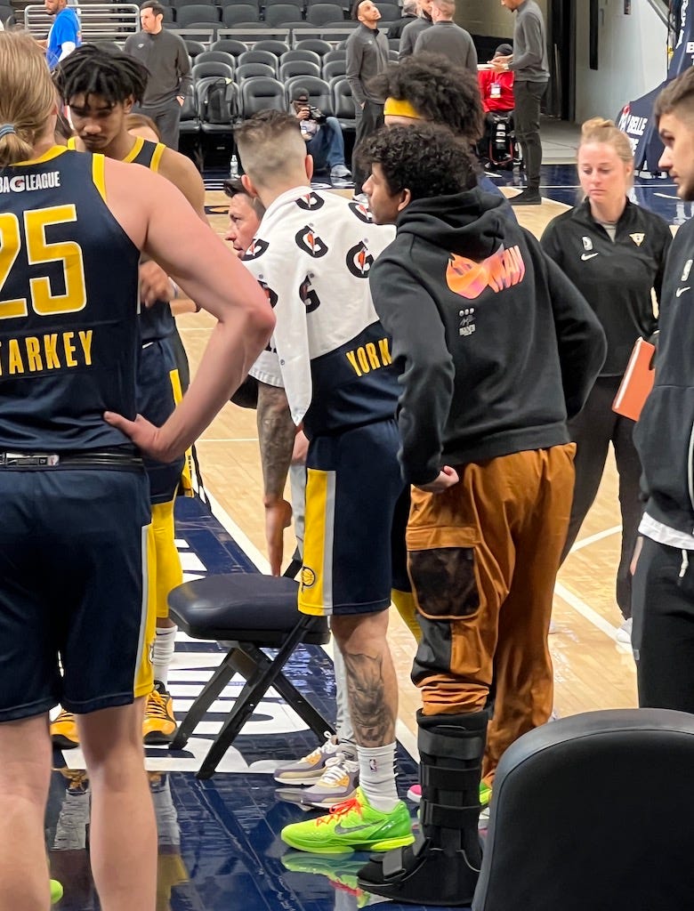 Mad Ants rookie guard Eli Brooks with his left foot in a boot.