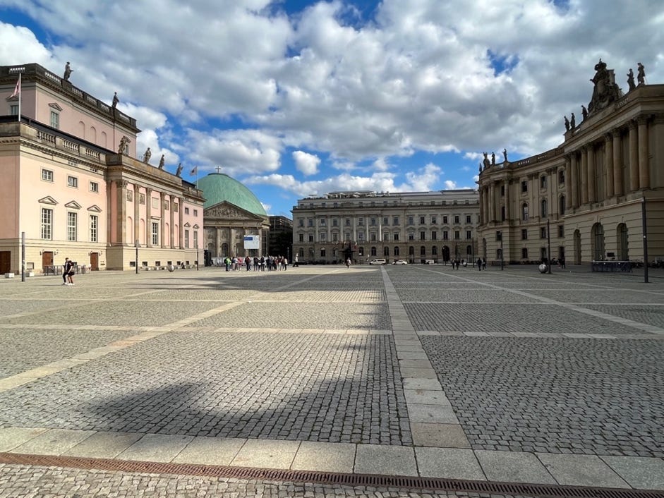 A large courtyard with stone pavement

Description automatically generated with medium confidence