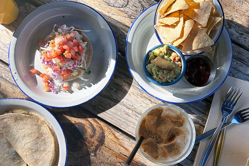 Plates of Mexican food and horchata from La Tortilleria in Kensington.