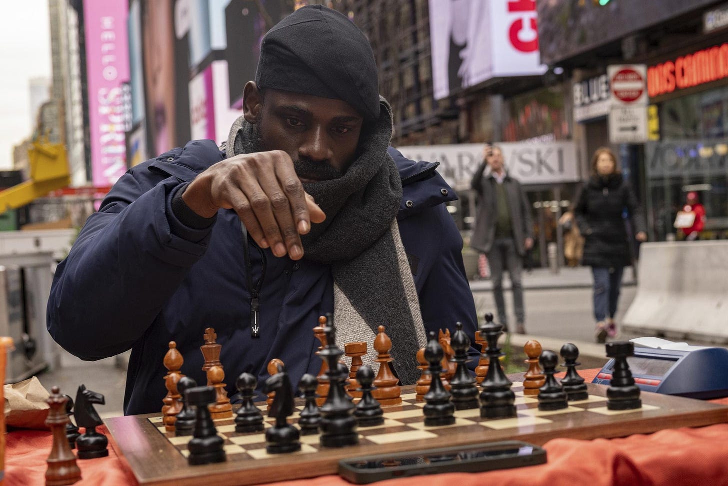 Tunde Onakoya plays a chess game in Times Square, New York. 