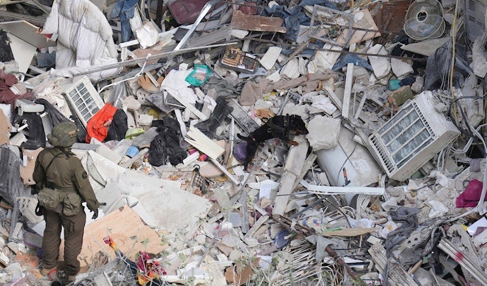 An Israeli military working dog searches rubble for survivors in an area hit by a missile fired from Iran, near Tel Aviv, occupied Palestine, Sunday, June 15, 2025.(AP) An Israeli military working dog searches rubble for survivors in an area hit by a missile fired from Iran, near Tel Aviv, occupied Palestine, Sunday, June 15, 2025.(AP)