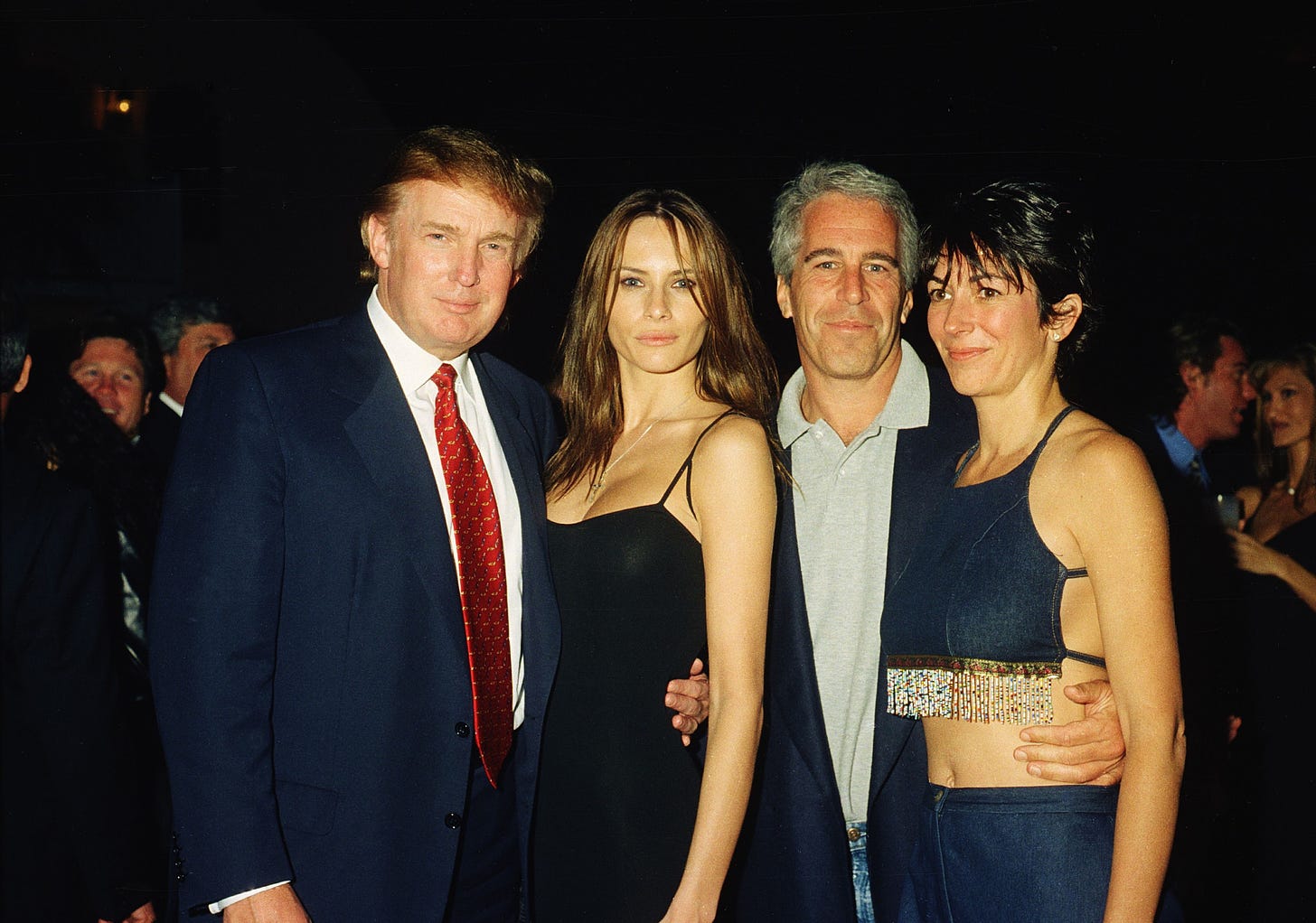 Donald Trump and his then-girlfriend Melania Knauss, Epstein, and Maxwell pose together at the Mar-a-Lago club, Palm Beach, Florida, February 12, 2000