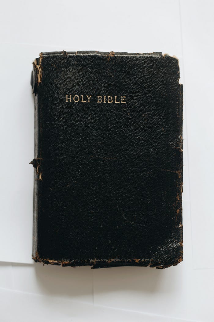 A worn and well-read copy of the Christian Bible. A worn and well-read copy of the Christian Bible.