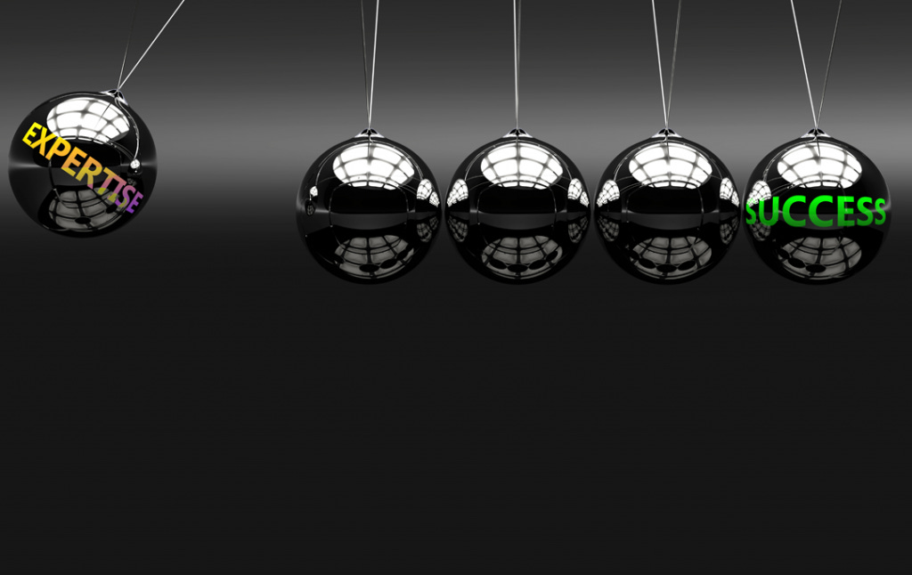 Picture of pendulum balls illustrating expertise is key to success in building trust