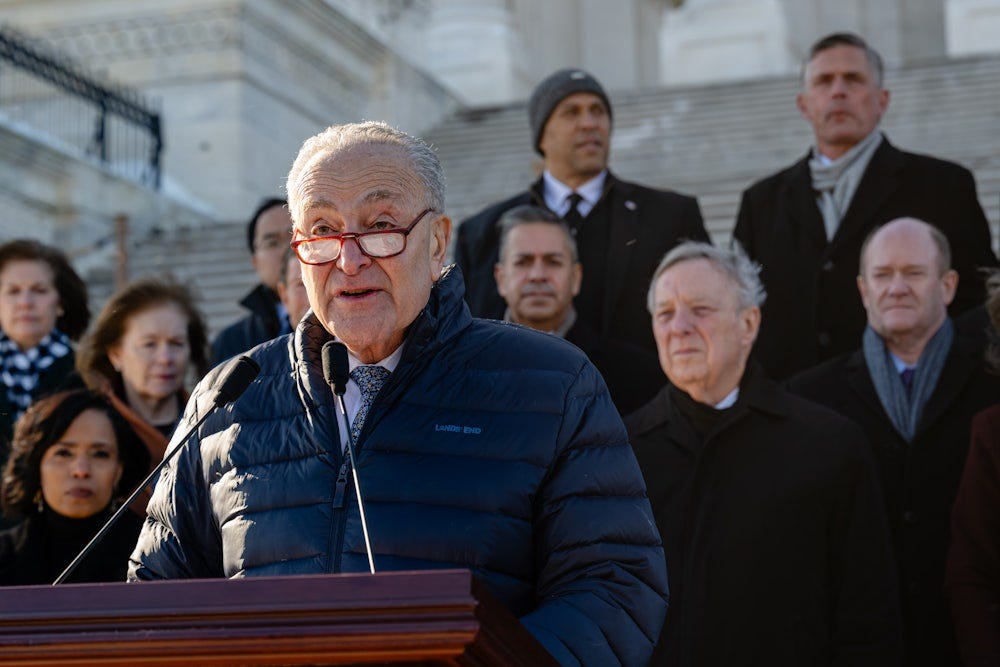 Senate Minority Leader Chuck Schumer speaks during a press conference at the Senate steps with a caucus of Democratic Senators before returning to the Senate chamber to vote on the Laken Riley Act.