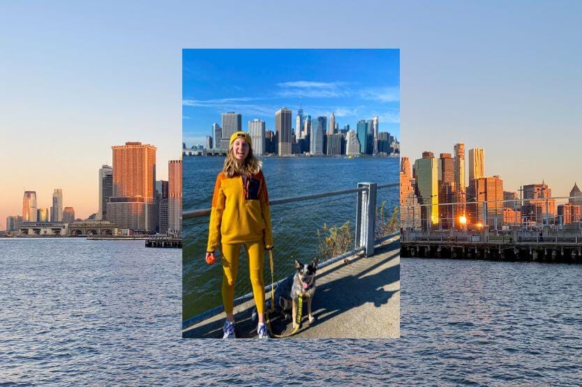 A photo of Haley the human and Scout the blue heeler posing on a pier at the Brooklyn Bridge Park is overlayed on top of a landscape photo of the New York City skyline