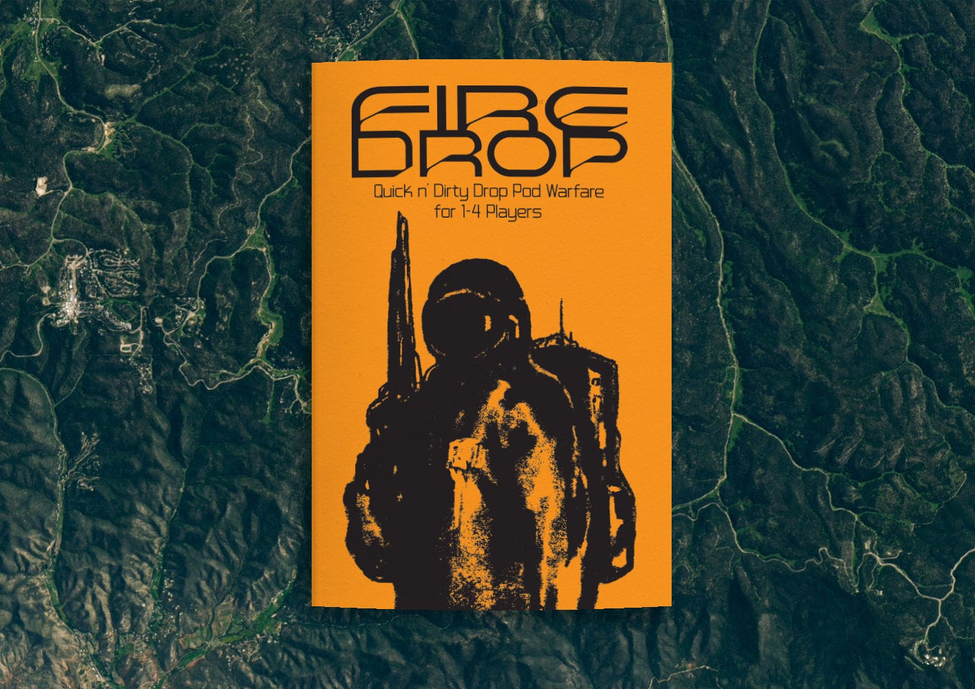 A mockup of a zine with an orange cover and black text reading "FIREDROP Quick N Dirty Drop Pod Warfare for 1-4 Players" alongside a black, smudgy illustration of a soldier in a space suit wielding a rifle.