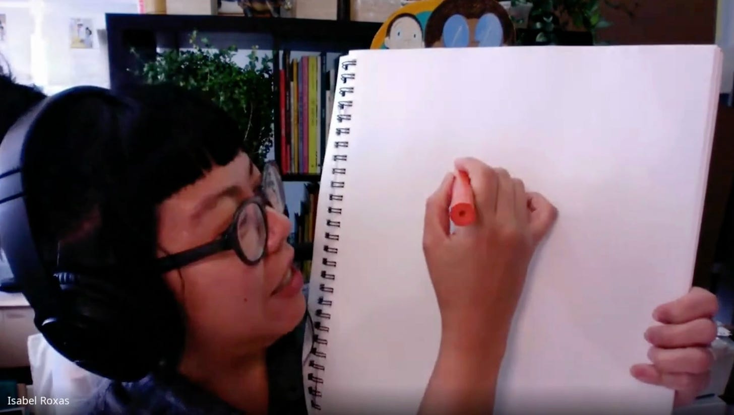 A still from a video showing Isabel Roxas drawing on a sketchbook in her studio.
