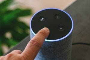 Ai speaker with finger hitting the off button