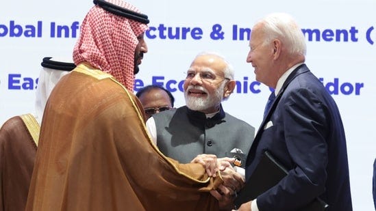 US President Joe Biden exchanges greetings with Saudi Arabian Prime Minister and Crown Prince Mohammed bin Salman bin Abdulaziz Al Saud in the presence of Prime Minister Narendra Modi during the launch of the India-Middle East-Europe connectivity corridor as part of the G20 Leaders' Summit in New Delhi on Saturday. (HT Photo)