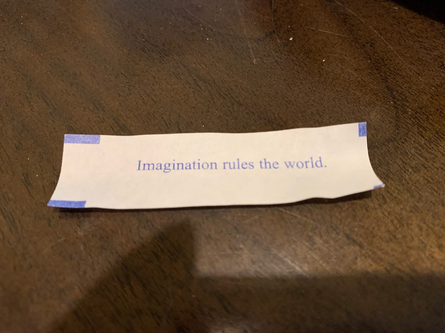Fortune from a fortune cookie that reads, "Imagination rules the world."