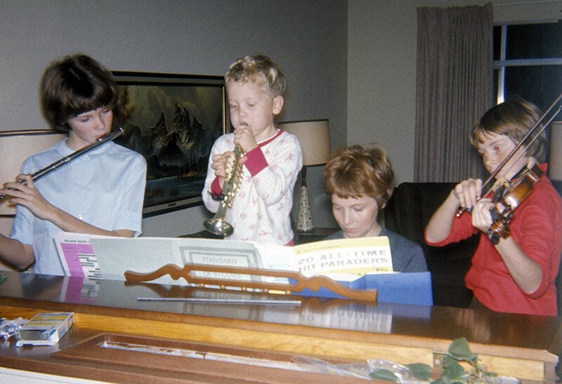 The family band in California with my mother, Mary Perkins, at the piano. Family photo.
