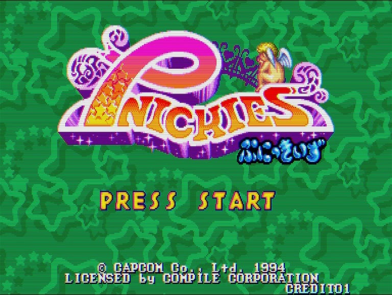 A screenshot of Pnickies' title screen, which features a starry green background, and an angel's buttcrack sitting atop the logo. No, really.