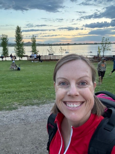 Photo of Jane Pilger at the Boulder reservoir smiling at sunrise