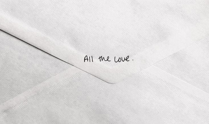 This may contain: an envelope with the words all me love written on it