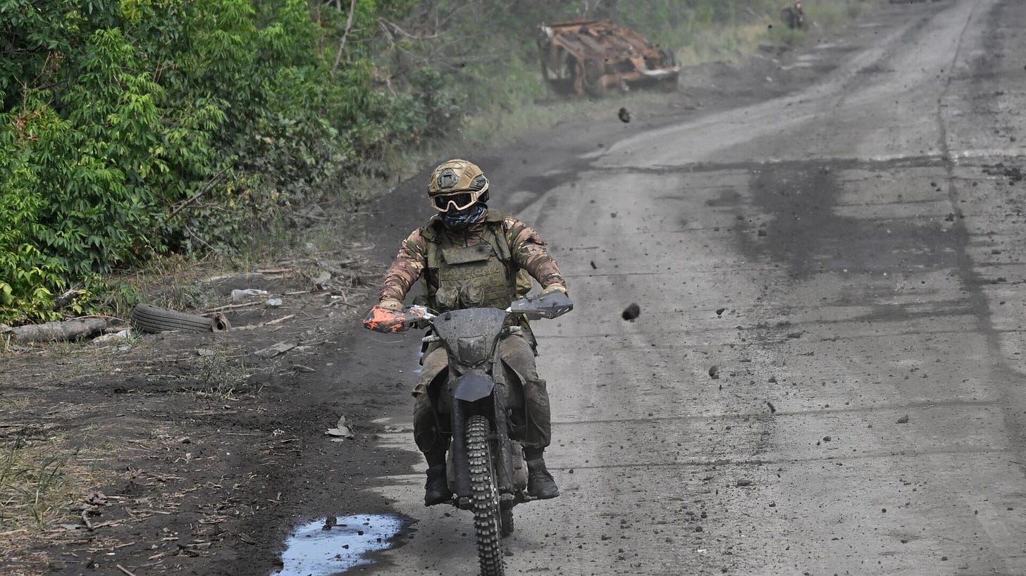 A Russian serviceman riding a motorcycle in the zone of the special military operation in Ukraine.
 - Sputnik International, 1920, 01.01.2025