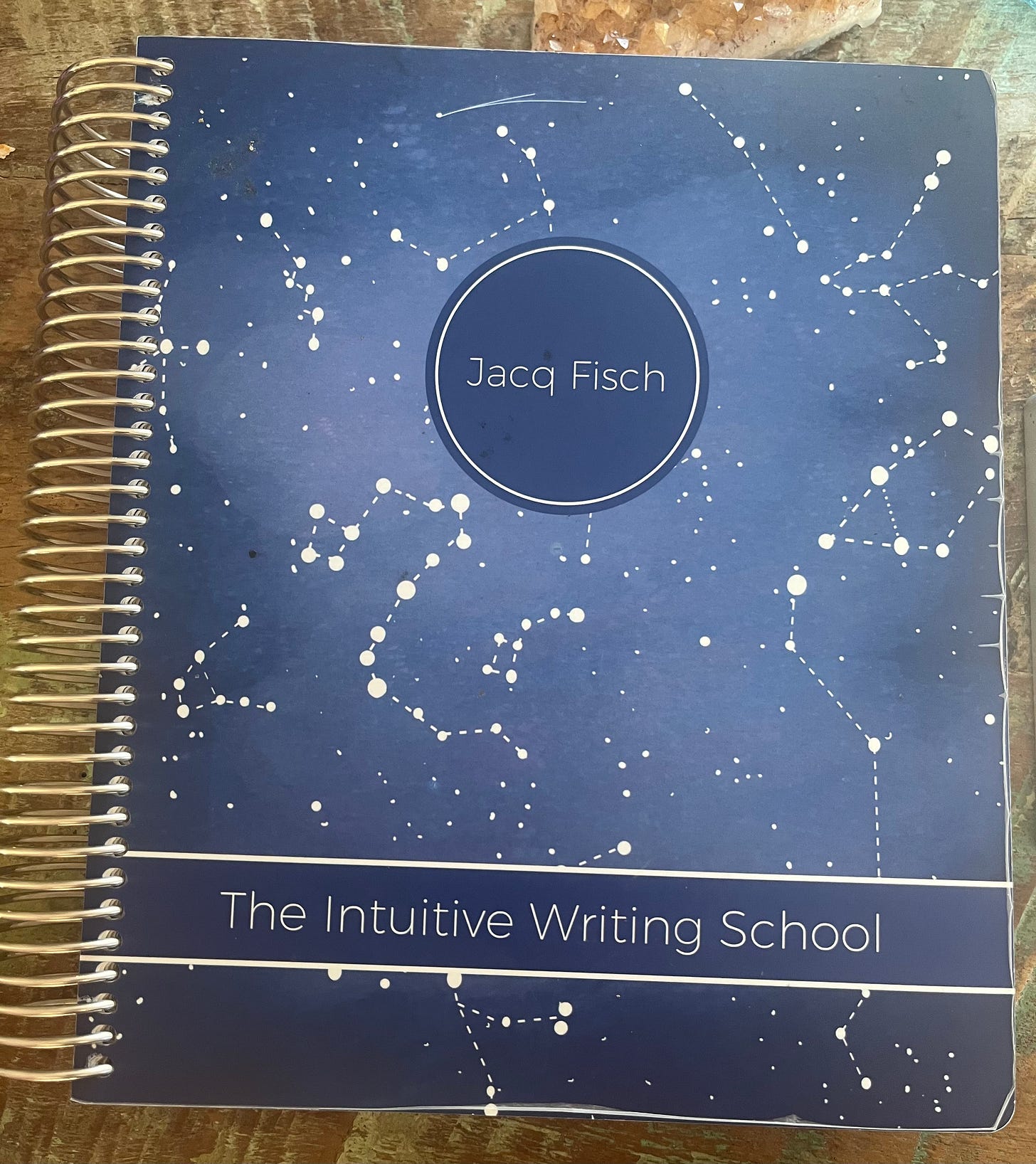 Jacq Fisch of The Intuitive Writing School Paper Planner for 2023 with deep blue background and white stars