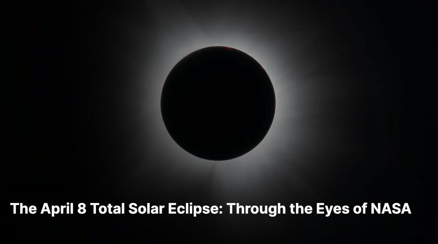 NASA image of the April 8, 2024 total solar eclipse, showing the sun entirely obscured by the moon with a faint corona visible around the edges.