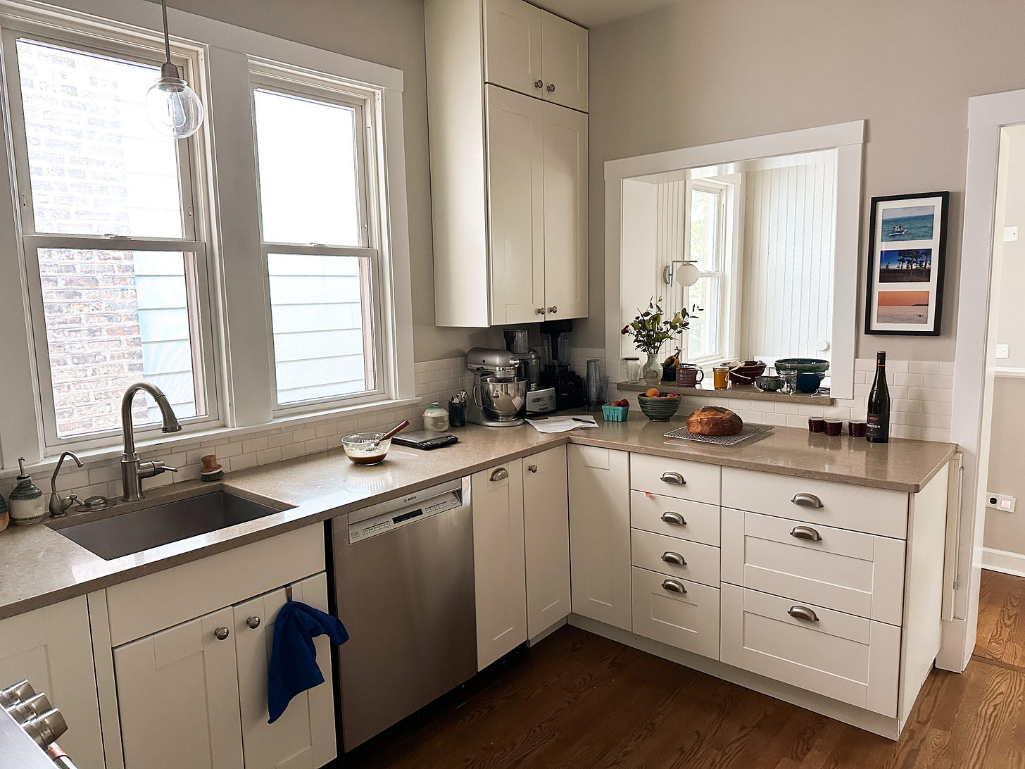 Kitchen with light coloured cupboards.