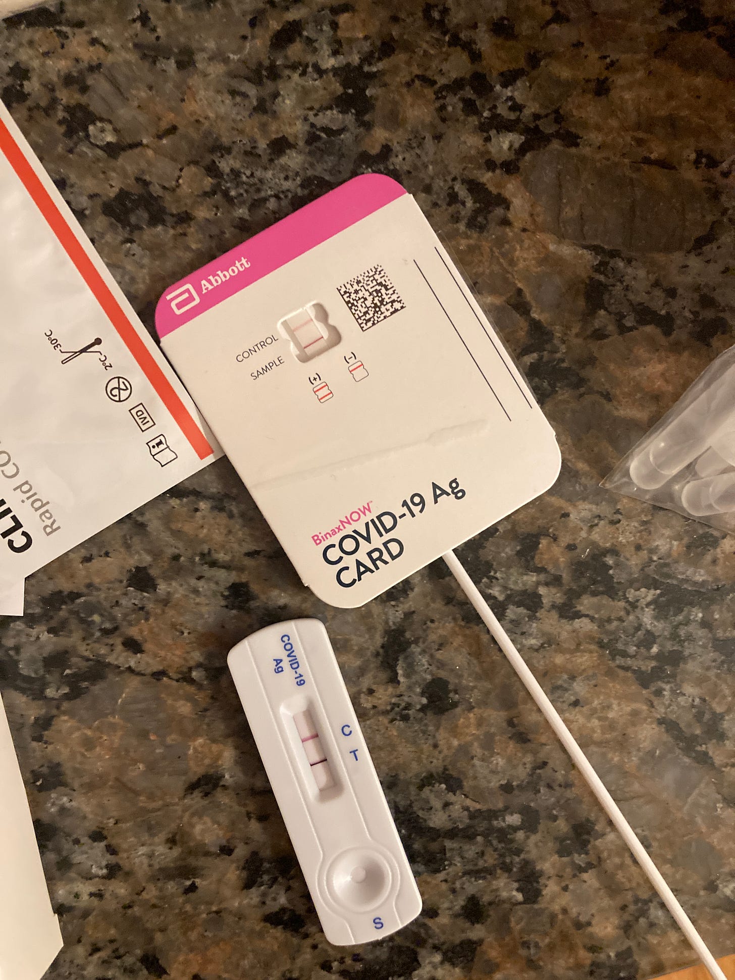 Image of two positive at-home COVID tests