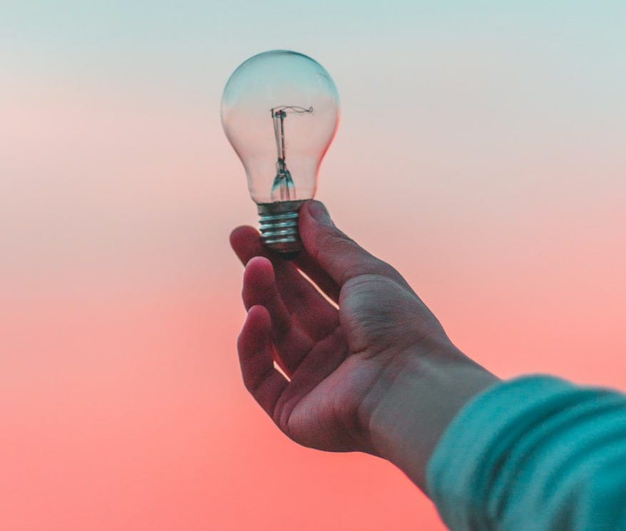 person holding light bulb