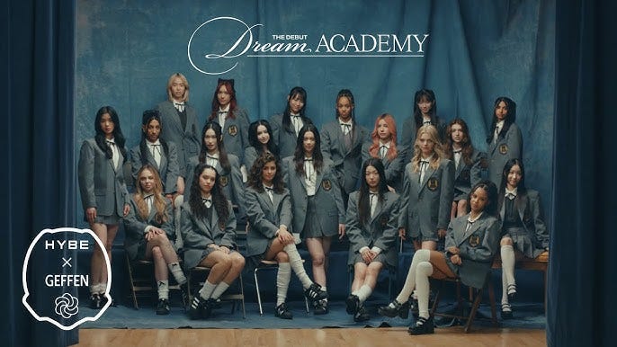 The Debut Dream Academy line-up in school girl outfits on cerulean backdrop.