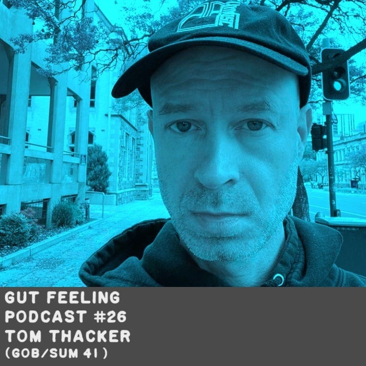 Gut Feeling Podcast with Tom Thacker of Gob and SUm 41. Tom is posing in front of a street light