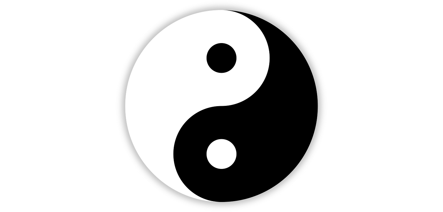 A yin-yang symbol. A circle divided into white and black halves by a single period of a sine-wave-esque curve, so both sides resemble a fish. One half is white, the other black. The white side has a black circle within it, the black side has a white circle within it