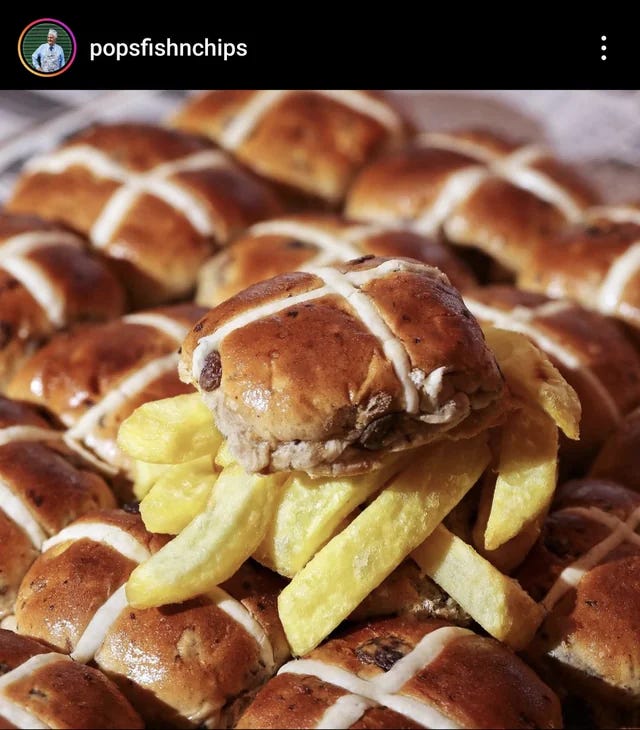 a hot cross bun stuffed with chips from the chip shop