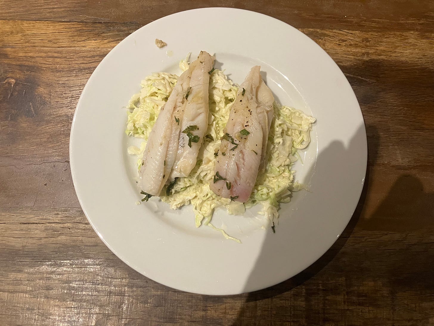 Plaice with olive oil and sage on a bed of mustardy slaw