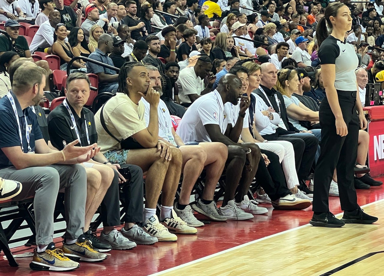 Members of the front office and coaching staff sit courtside to watch the Pacers Summer League team in Las Vegas.