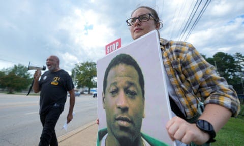 Woman protests with sign