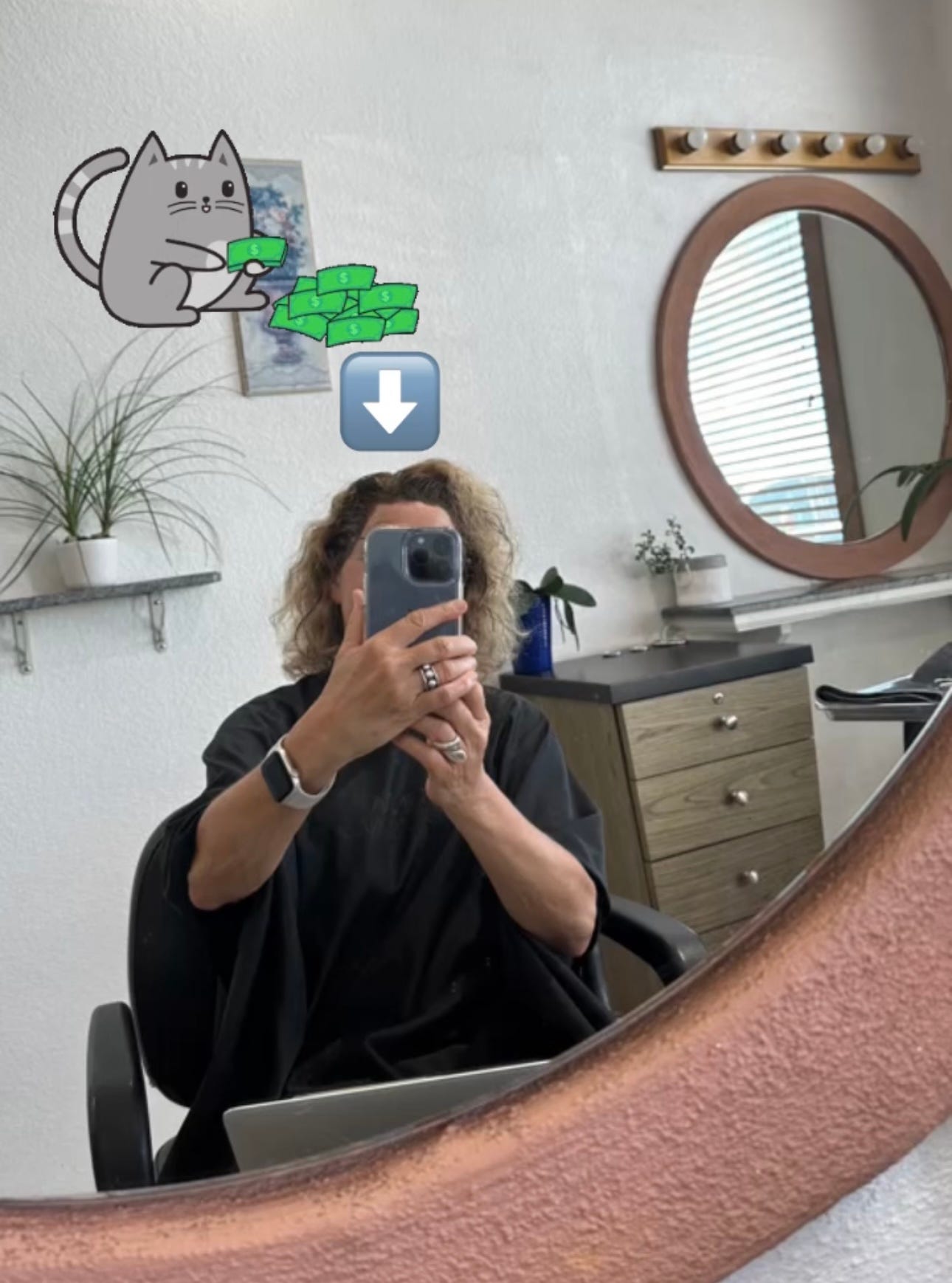 woman taking a selfie while getting her hair colored