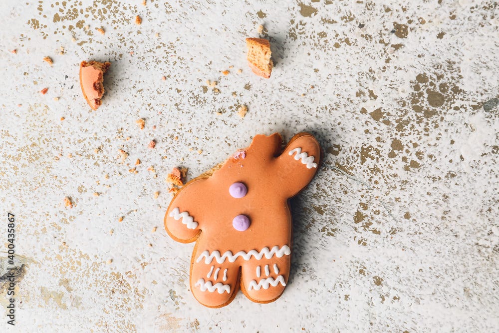 Broken gingerbread cookie on white background Stock Photo | Adobe Stock