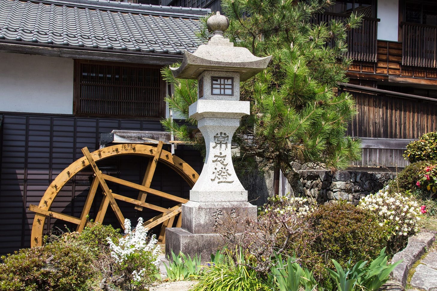 Japanese waterwheel photo by Terence Starkey on Unsplash